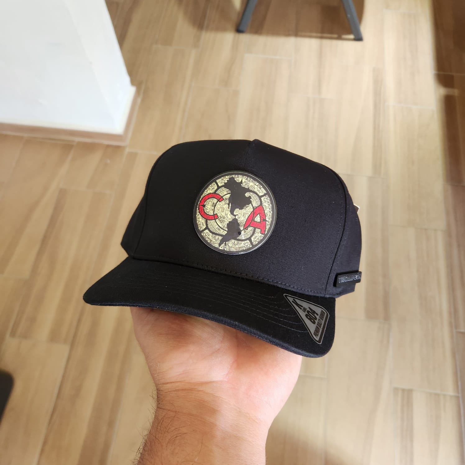 AMERICA CA GORRA NEGRA PLACA KAMEL