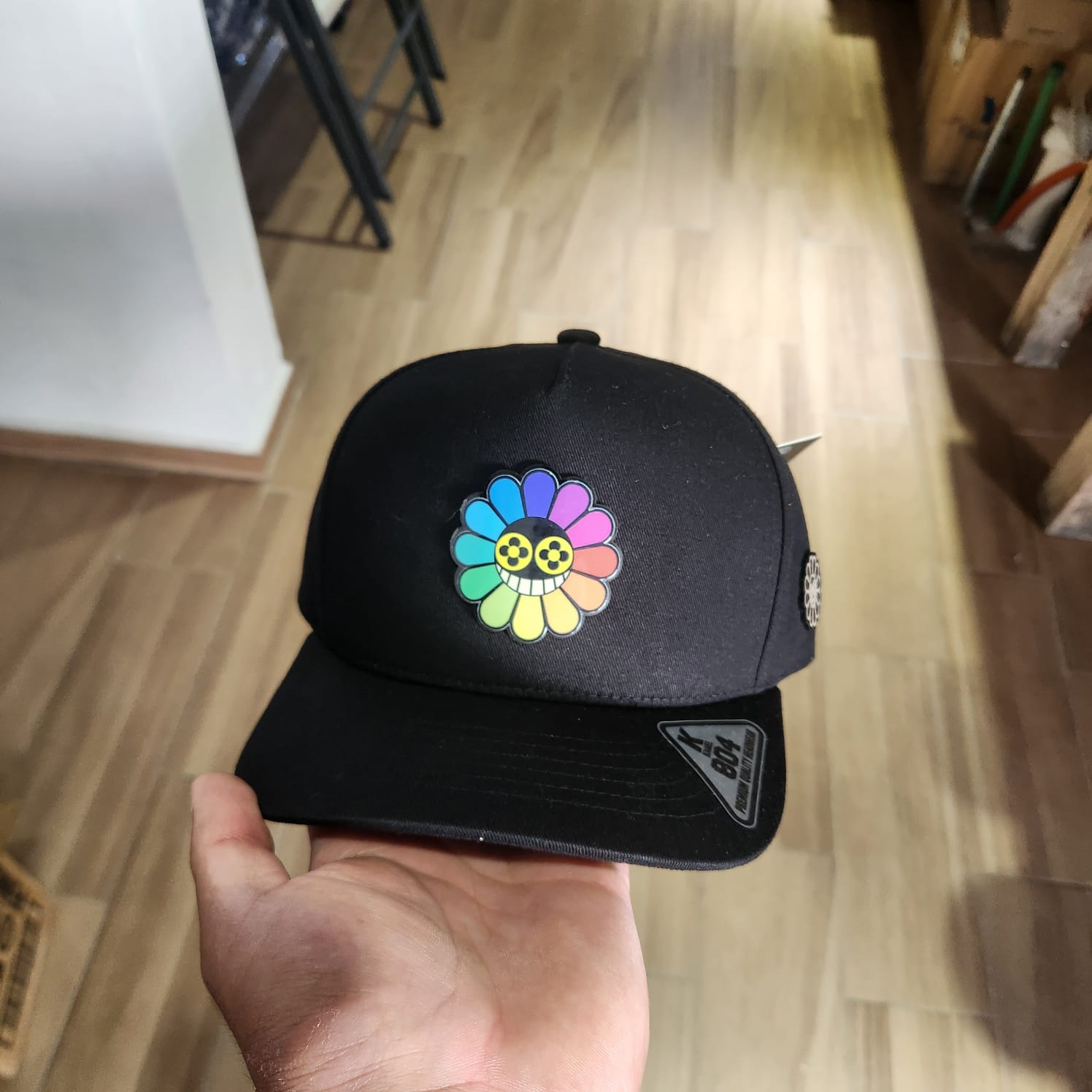 SOLO GIRASOL COLOR GORRA NEGRA PLACA KAMEL